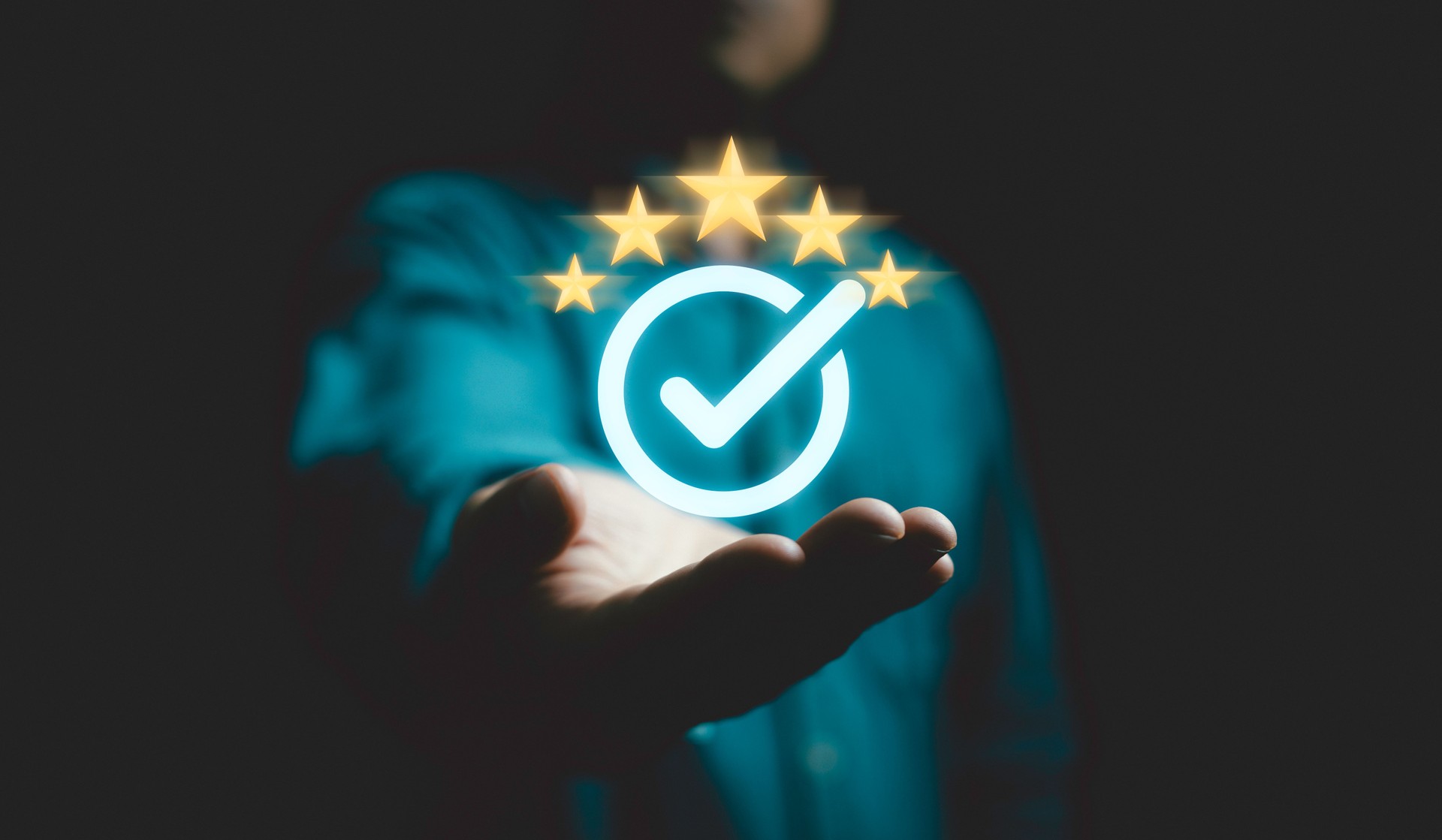 Businessman holding and showing the best quality assurance with golden five stars for guarantee product and ISO service concept.